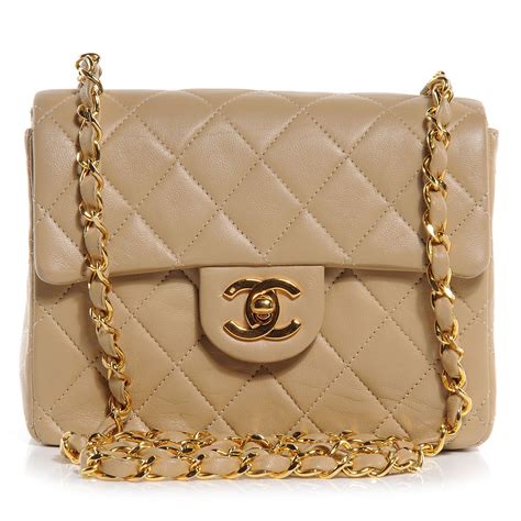 small chanel o pouch beige|Chanel small lambskin evening bag.